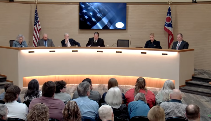 Medina City Council members meet on March 9, 2026, as residents fill the chamber to discuss immigration legislation, new business approvals, and infrastructure projects.